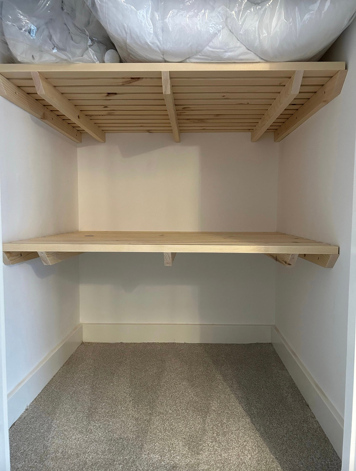 carpenter made wooden shelves designed to fit any cupboard perfectly